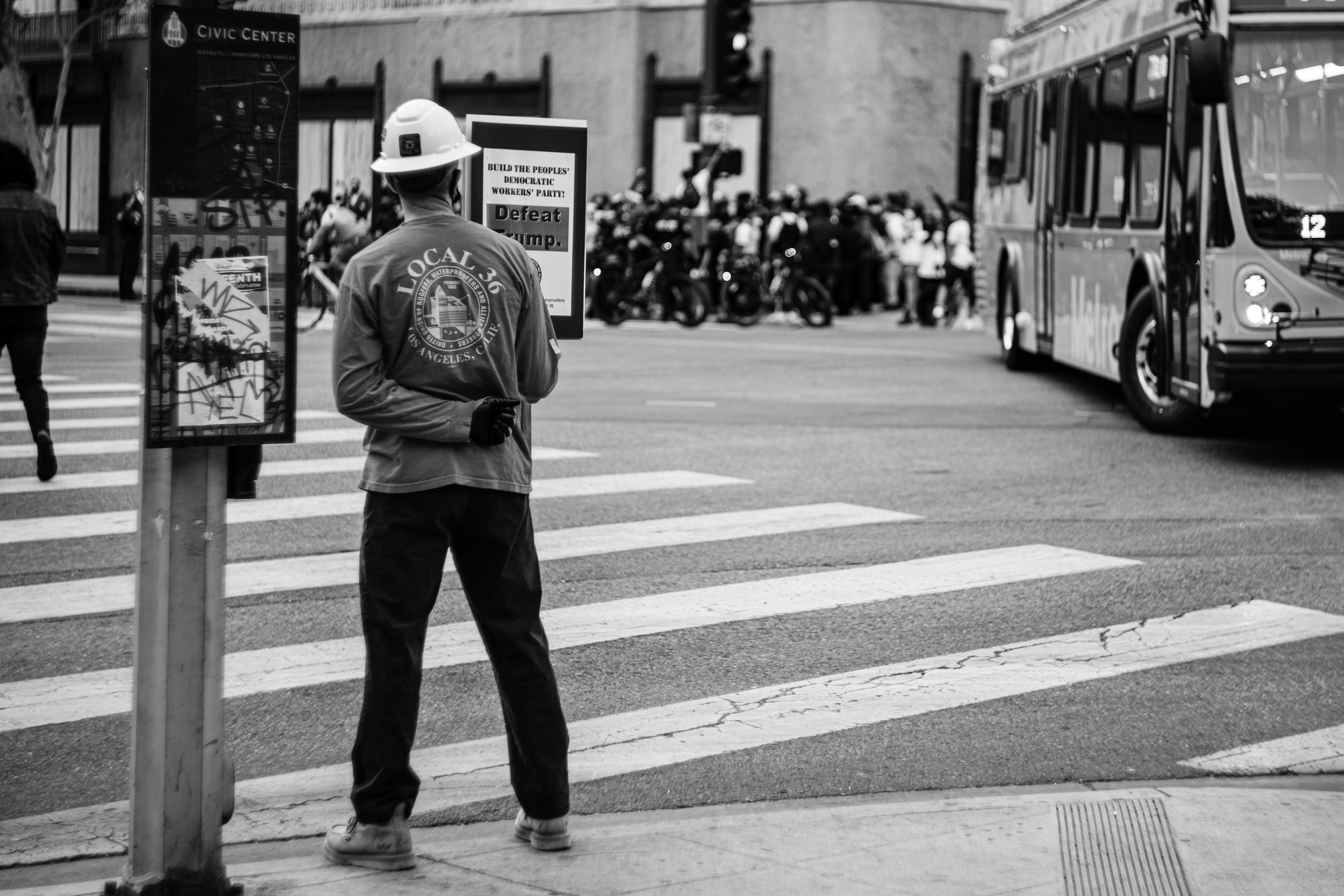 Construction Worker waiting on bus